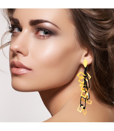 Drop gold plated earring with black leather.